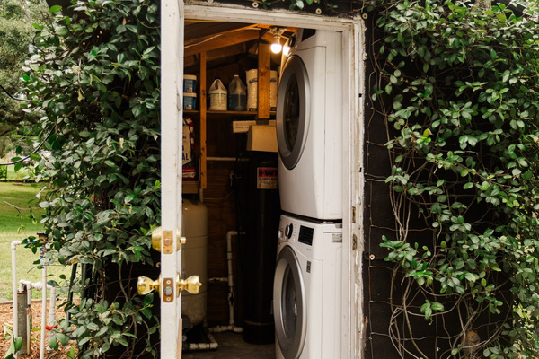In-unit laundry - handled in its own private building just off the house.