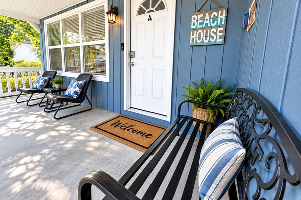 Porch Retreat: Enjoy serene mornings soaking in the sun on stylish seating with beachy vibes!