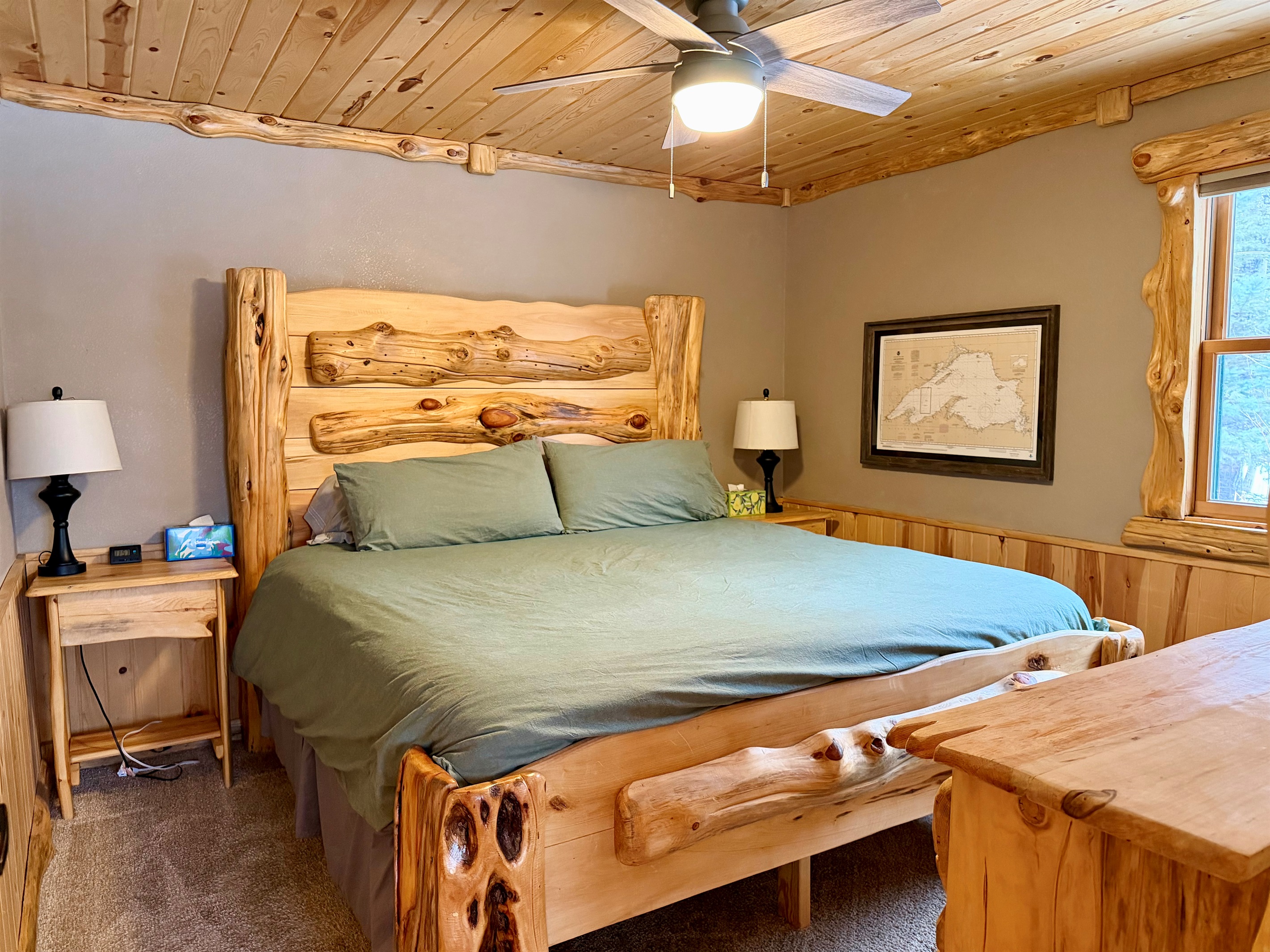 Cozy king bedroom located conveniently off the kitchen and living room. A quiet retreat after a day on the North Shore.