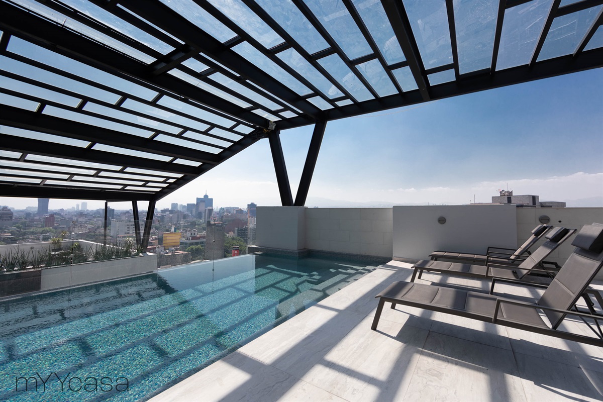 Shared rooftop pool, offering a refreshing experience with stunning views for residents to enjoy