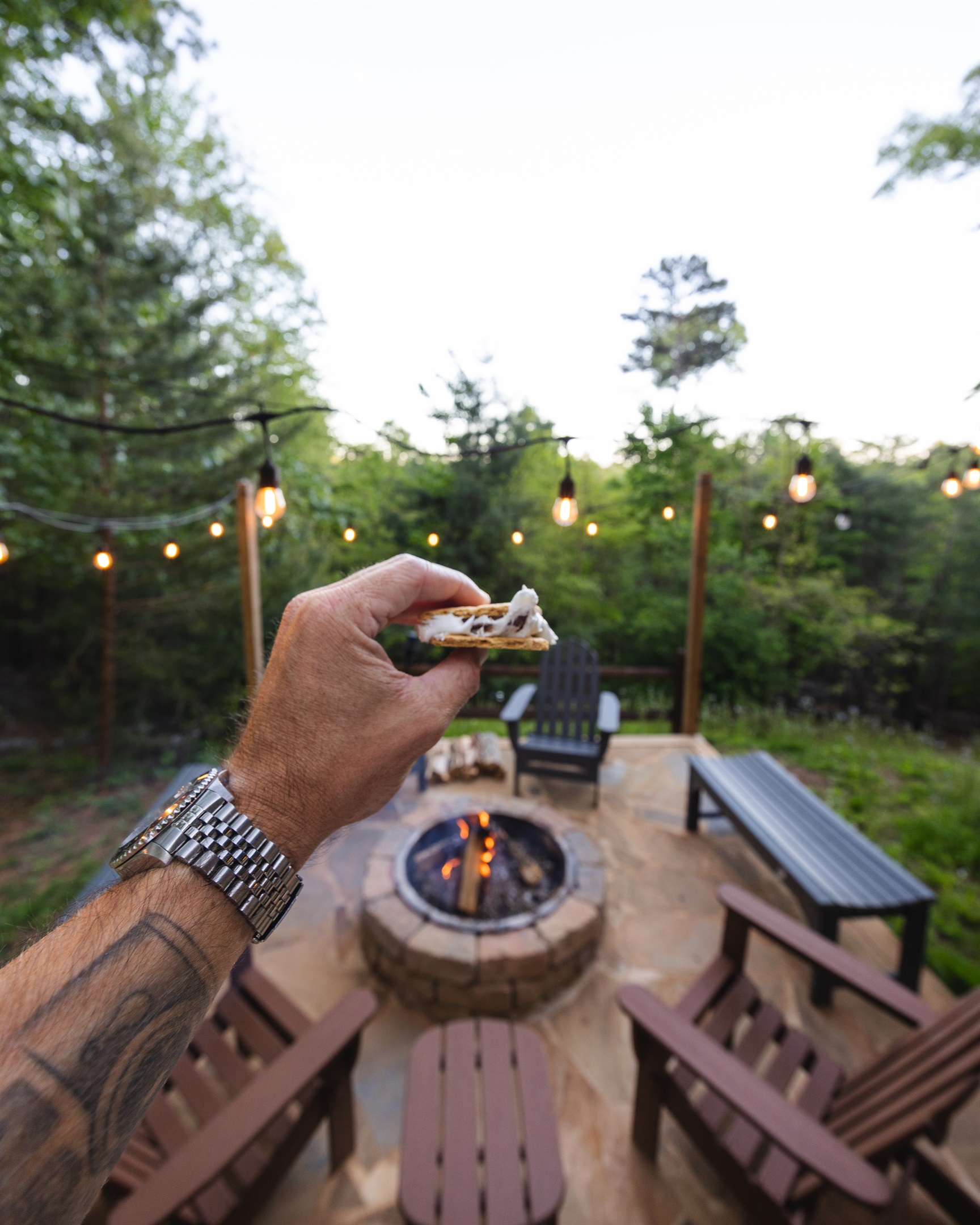 A s’more in hand by the firepit = an easy mountain night done right.