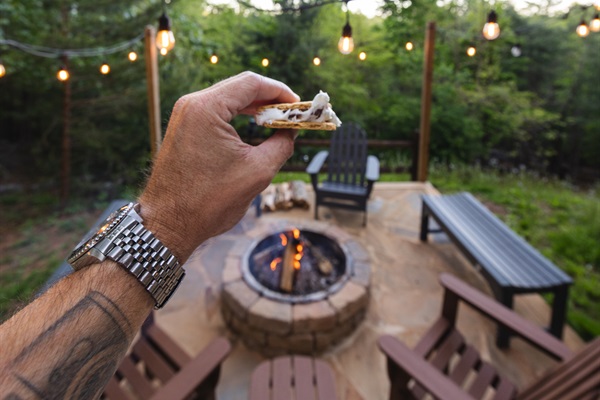 A s’more in hand by the firepit = an easy mountain night done right.