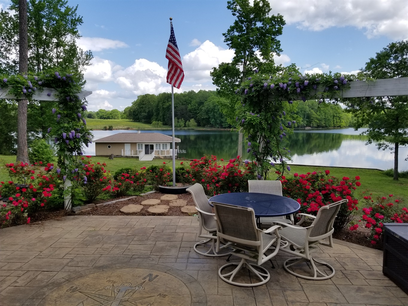 Patio perfection with a lakefront backdrop.
