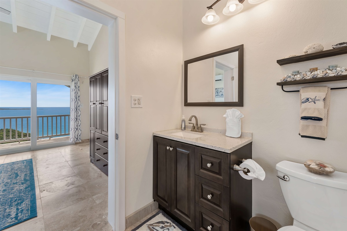 Bright and clean bathroom with double sinks and luxurious shower.