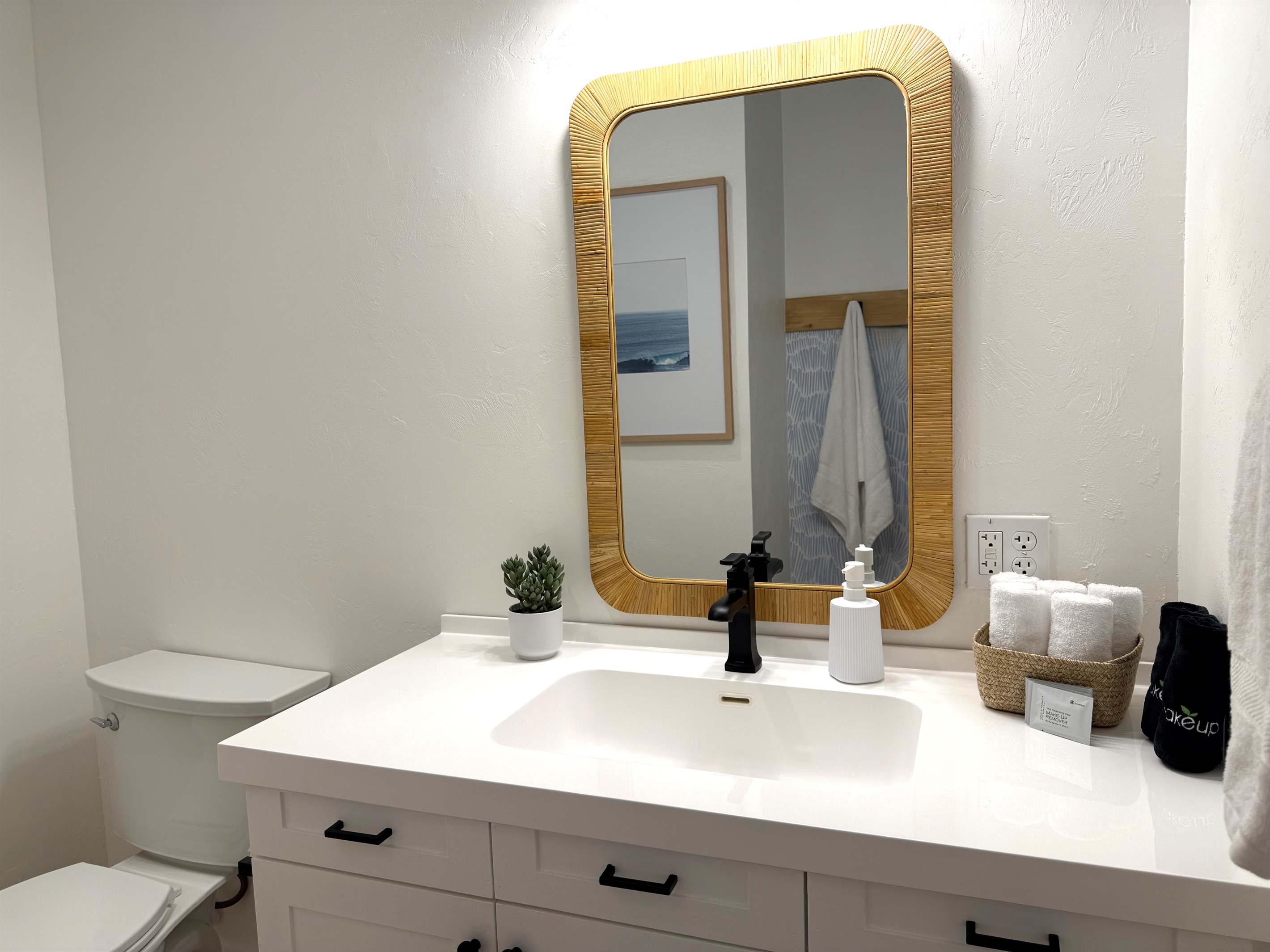 Bunkroom suite custom bathroom vanity. Wallpaper with integrated towel hooks