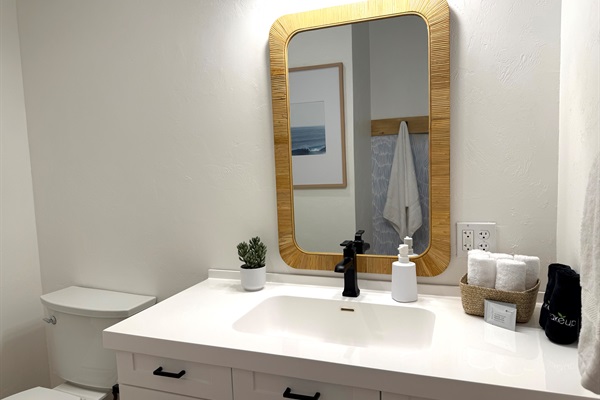 Bunkroom suite custom bathroom vanity. Wallpaper with integrated towel hooks