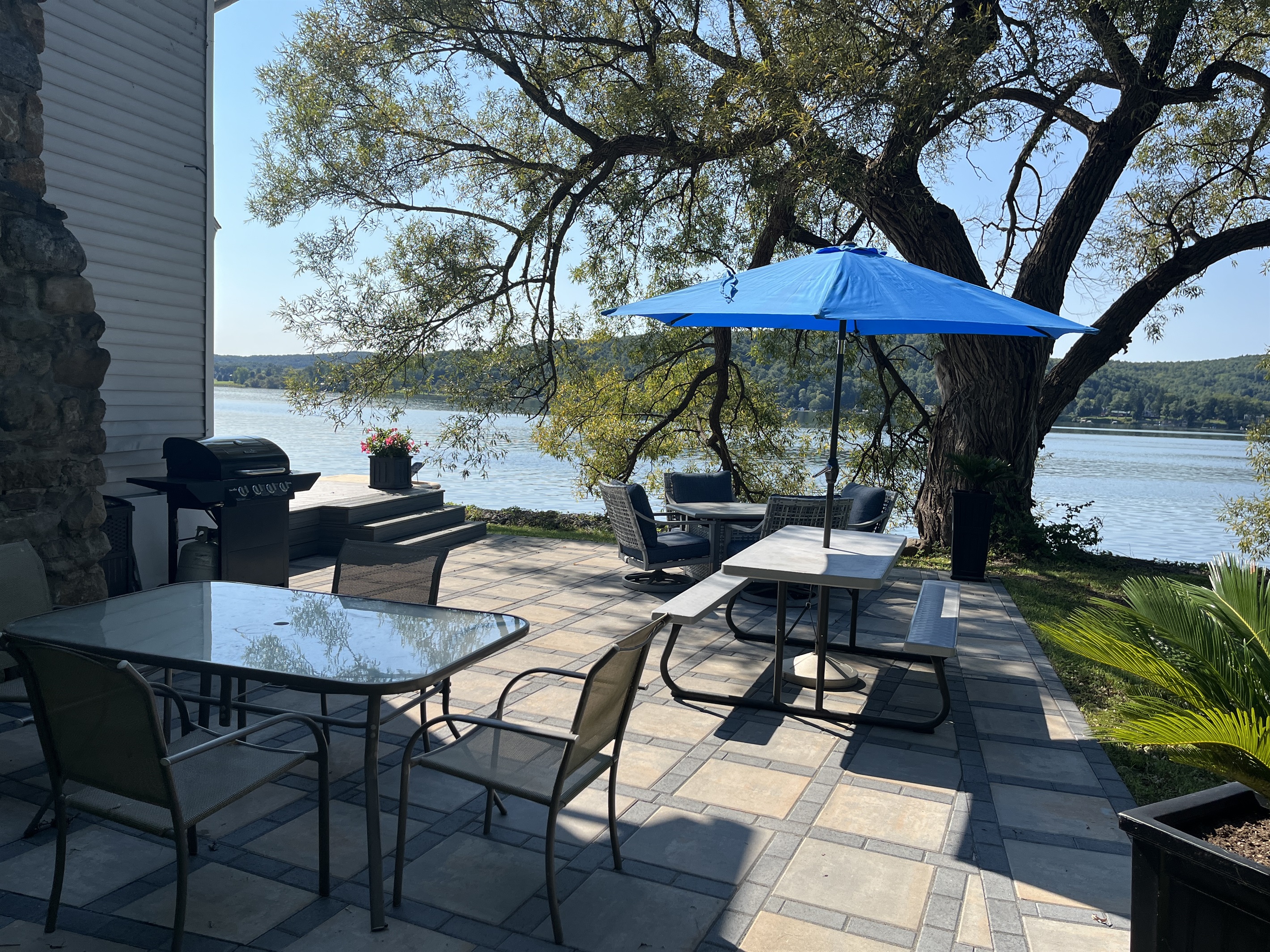 Patio for outdoor dining overlooking the water