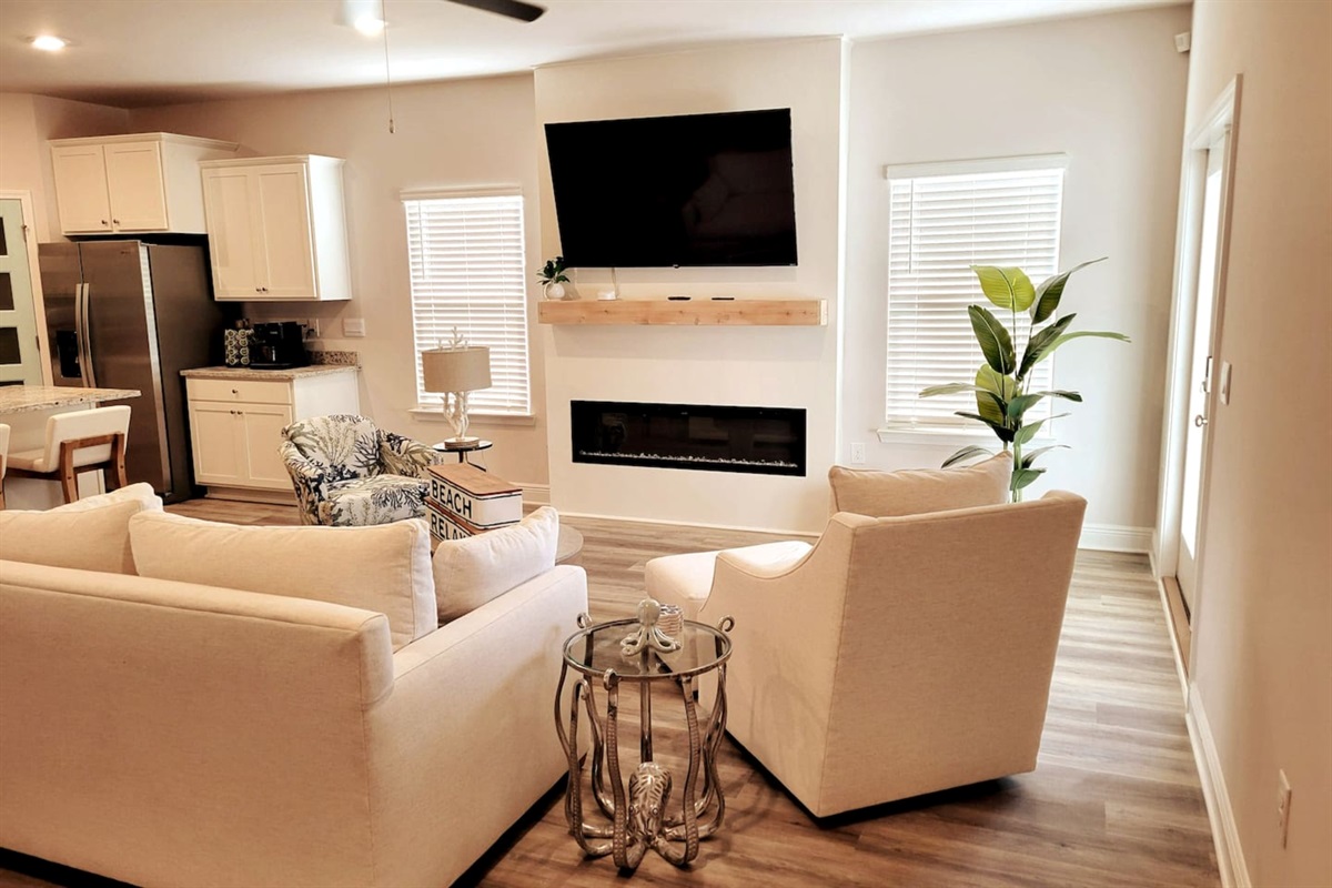 Cozy centered sleeper sofa in the heart of the open living area—extra beds + ultimate relaxation for family beach getaways.