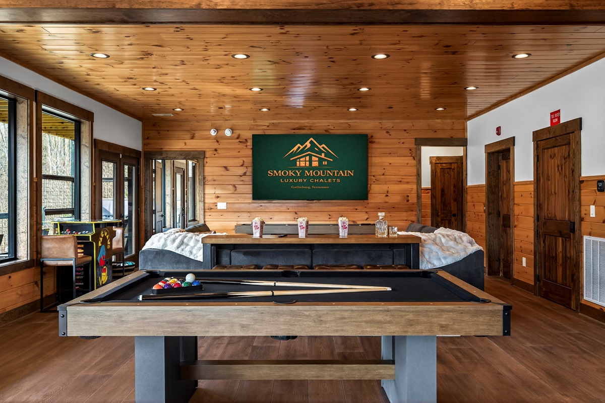 Ultimate Game Room -Watch movies or the big game on the 100-inch TV, relax on the plush sectional, or enjoy bar-top seating. Play pool, shuffleboard, foosball, and arcade tables, with a kitchenette for snacks and drinks—perfect for family fun & game nights