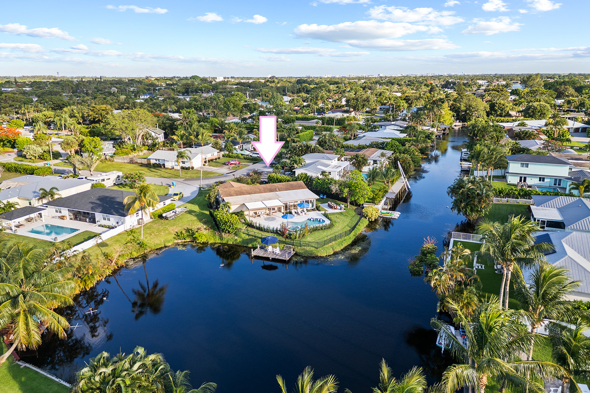 Nestled along a peaceful canal, this waterfront retreat offers space, privacy, and tropical surroundings.