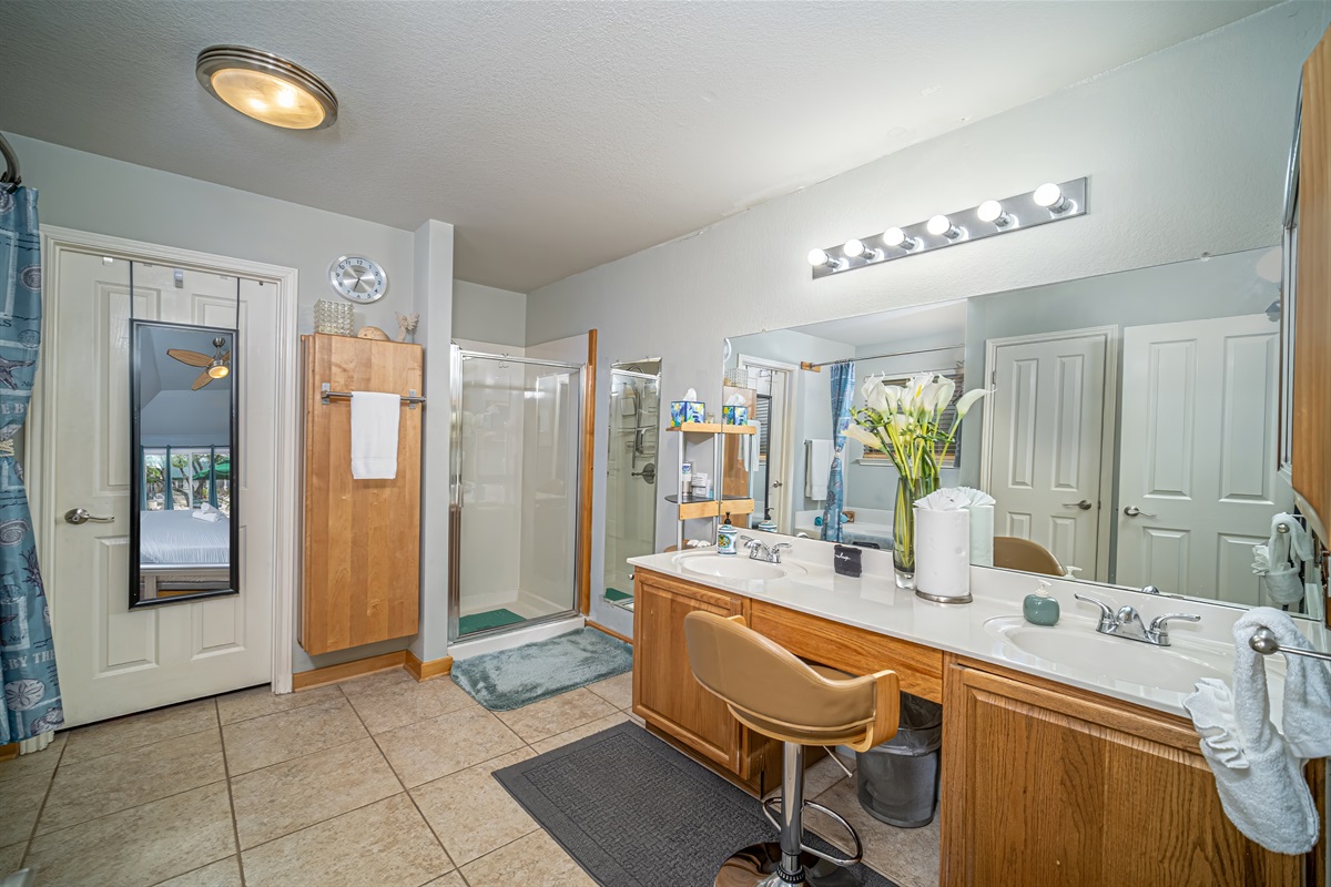 Master Bathroom has direct access from Master BR. Dual sink vanity, separate toilet room w window, standing shower. Privacy window over the garden tub provides lots of natural light. Bubble & Bath salts, hair & body wash provided.