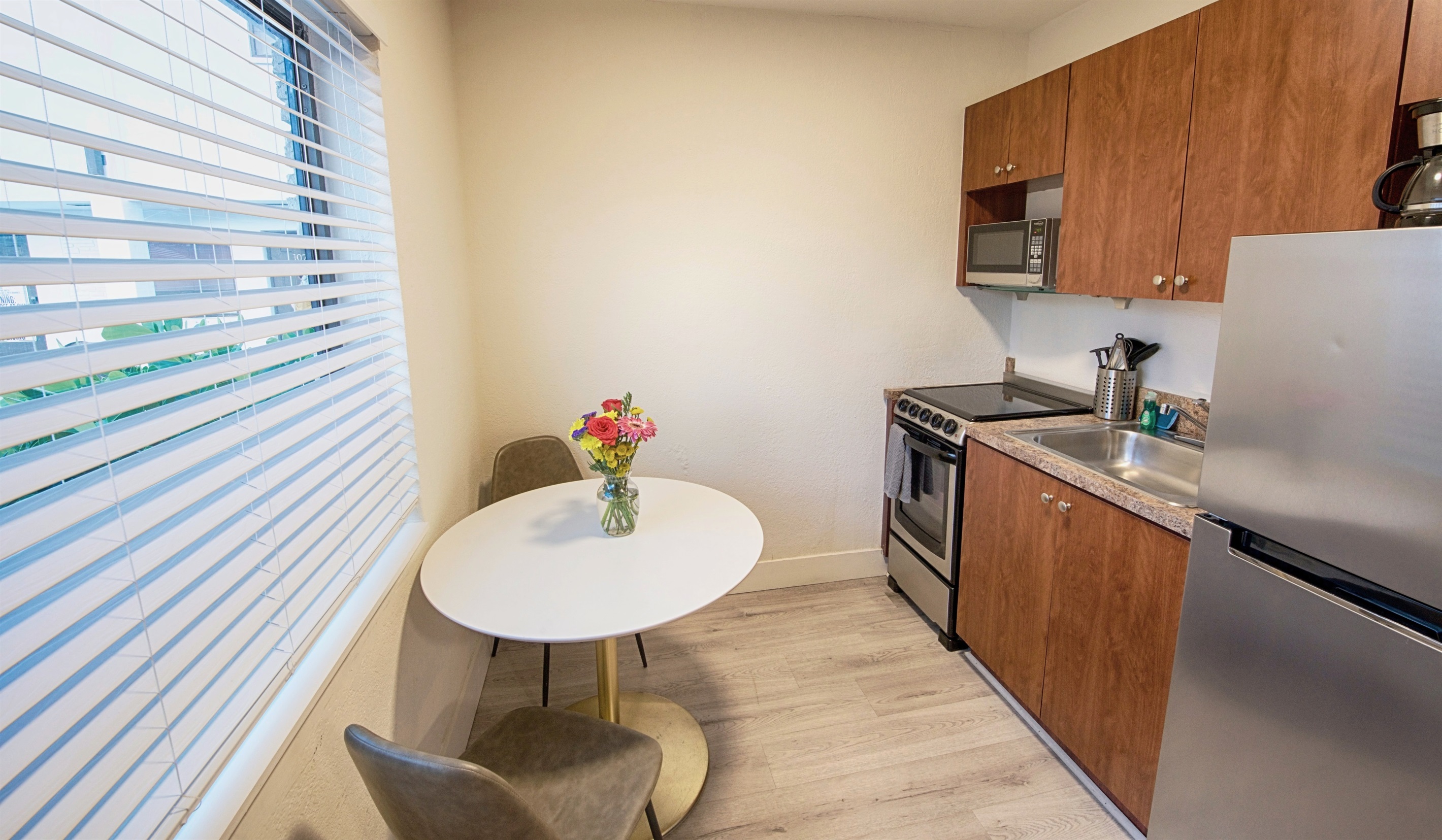 Stainless steel fridge, stove and microwave