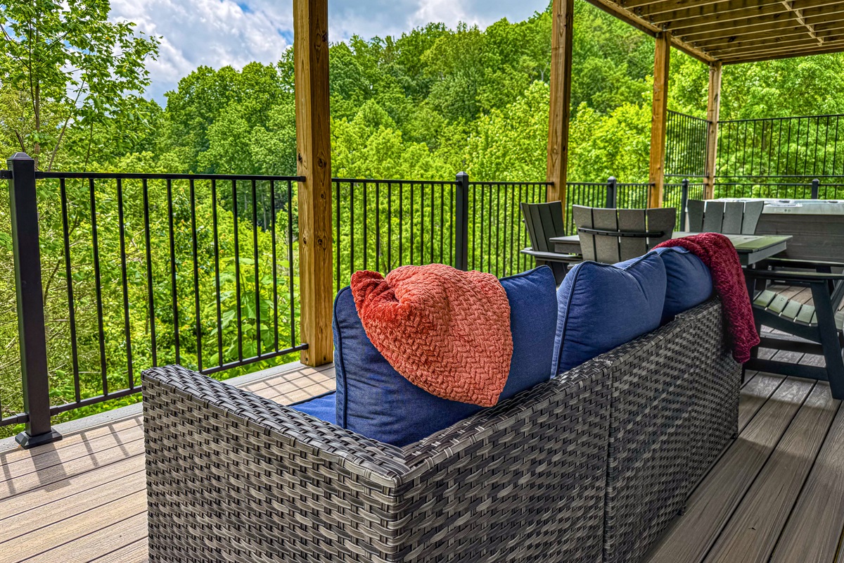 More comfy seating by the hot tub. Choose from a conversation area or cafe table.