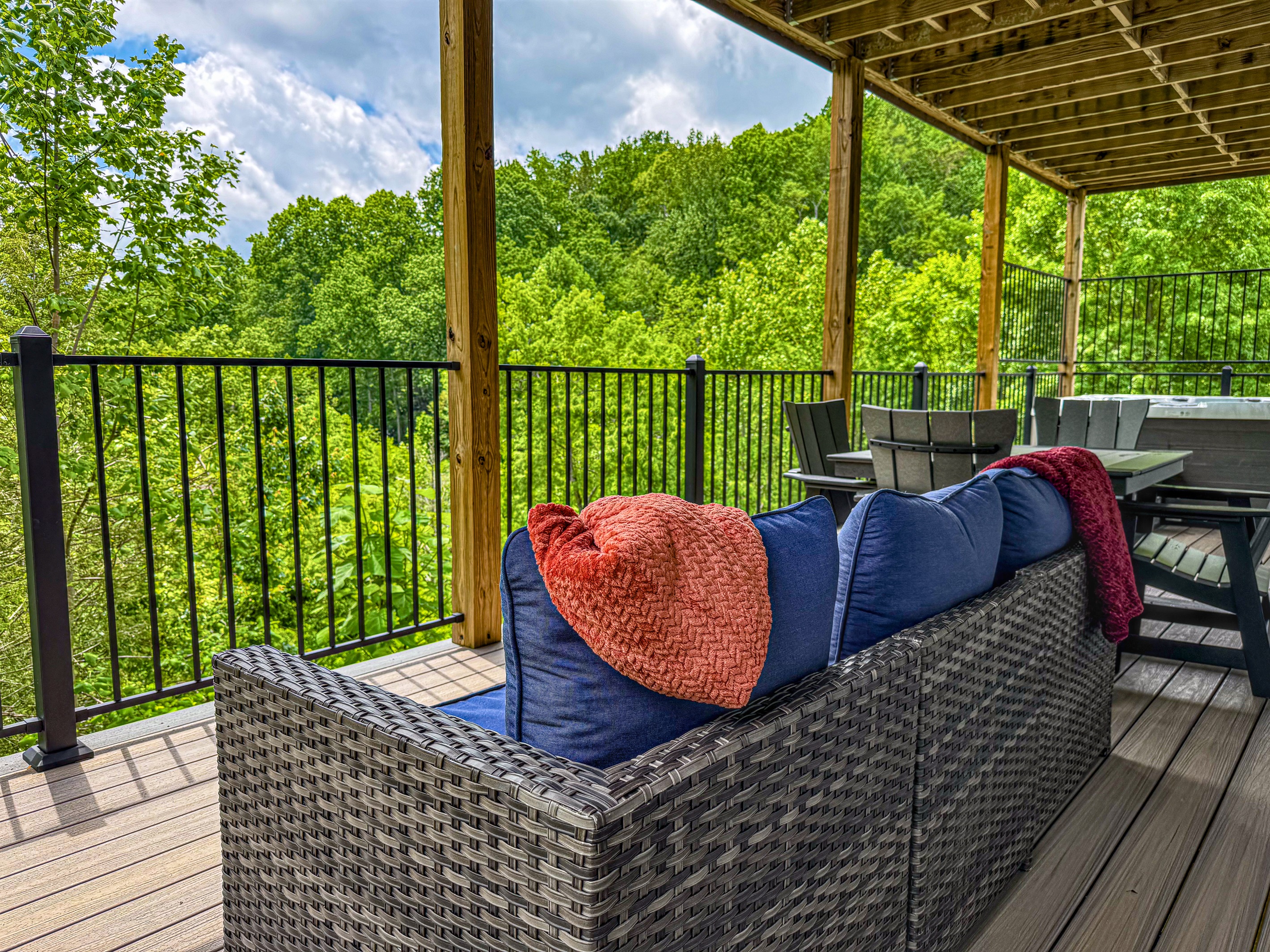More comfy seating by the hot tub. Choose from a conversation area or cafe table.
