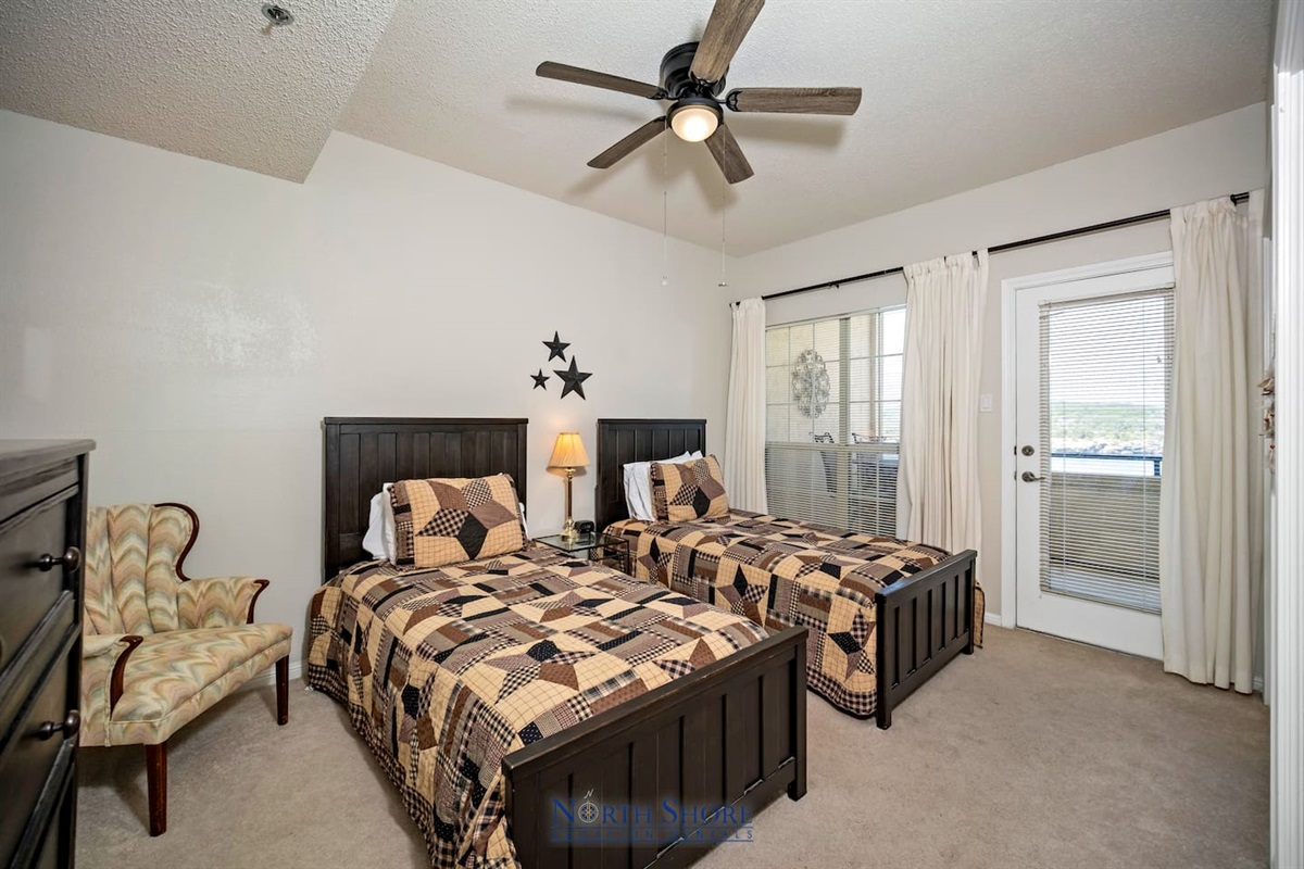 Twin Beds in Bedroom with Balcony Access