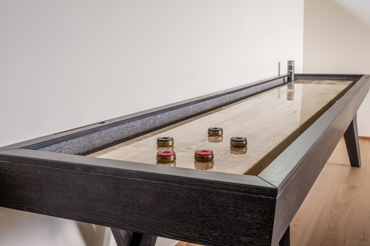 The game room enjoys a custom shuffle board for memorable games