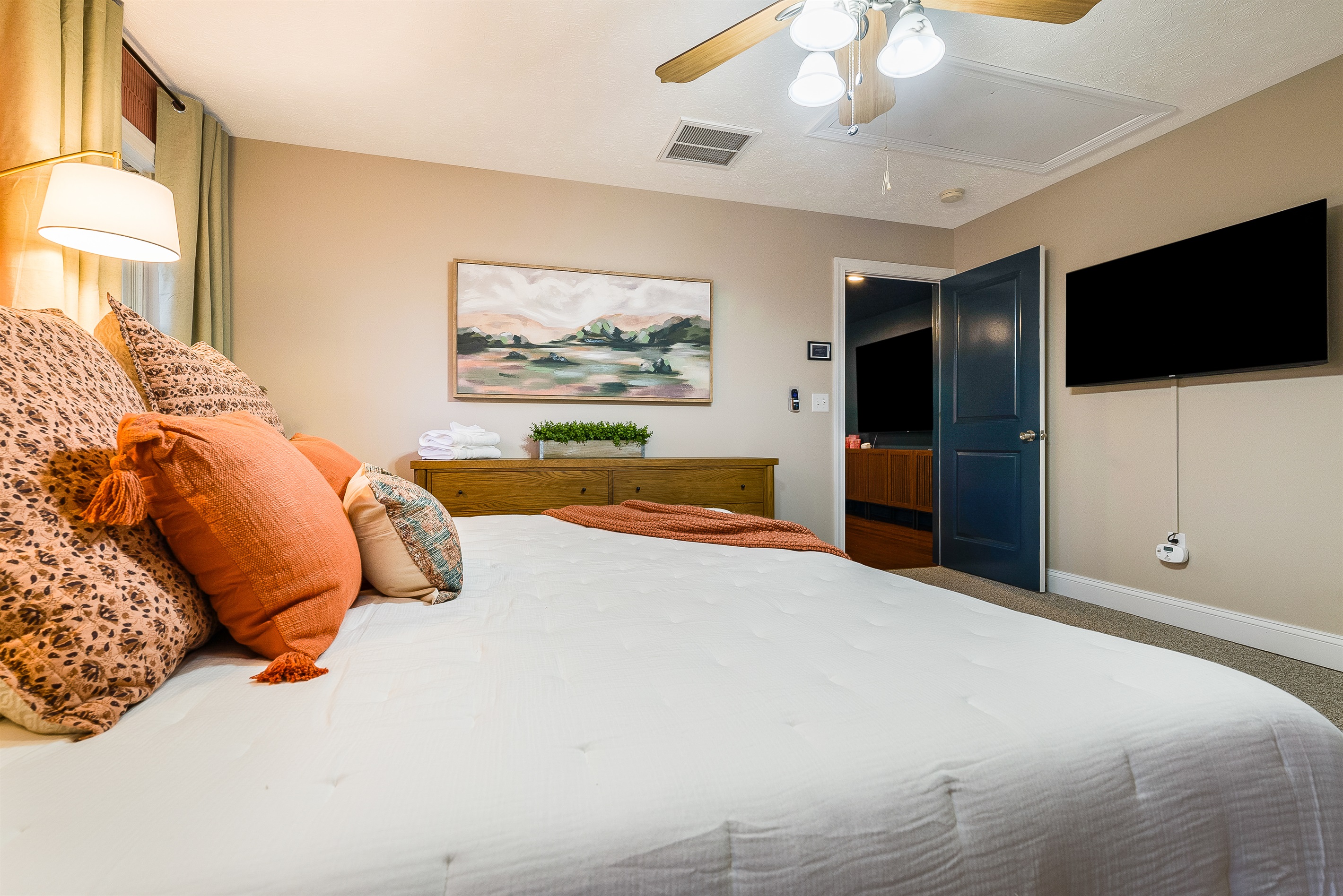 Accented with artwork and plenty of pillows, this king room blends comfort and style.