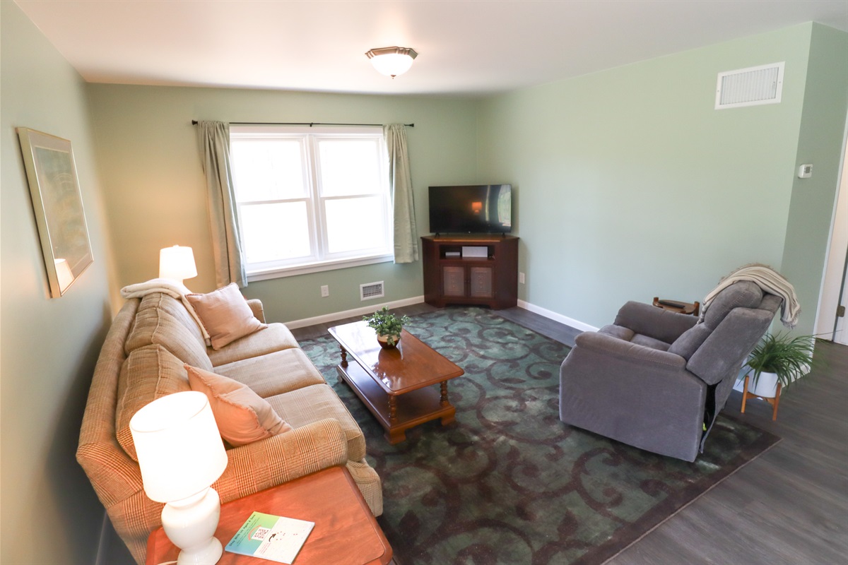 Spacious living area with smart tv