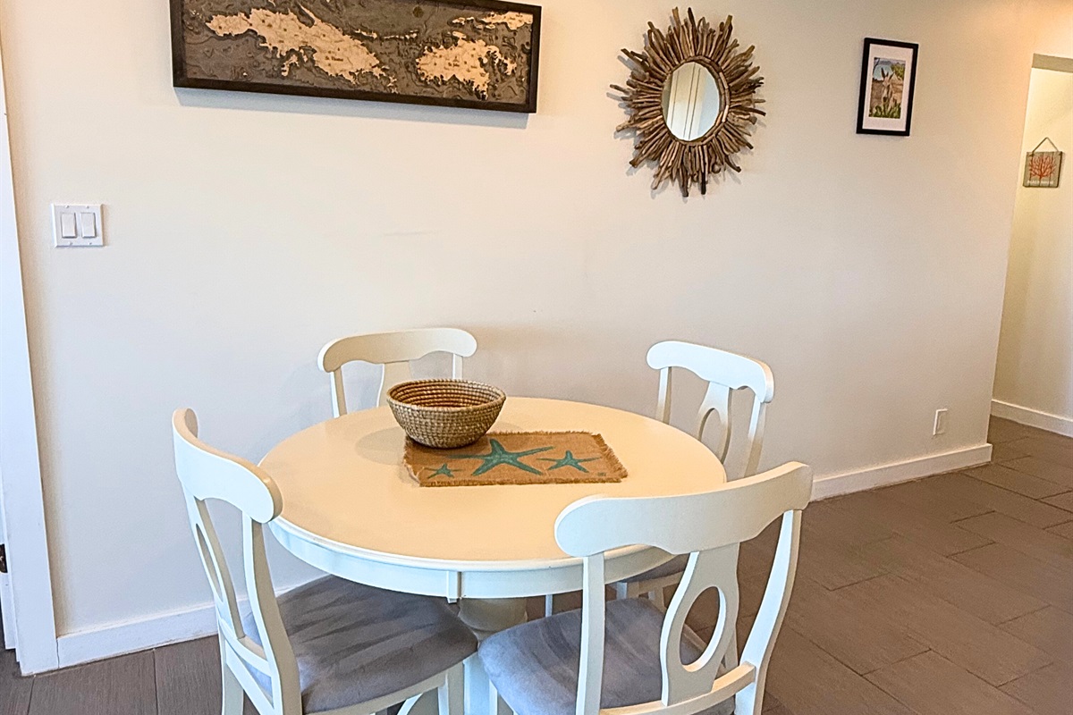 Dining area seats four, while the kitchen island has room for two more