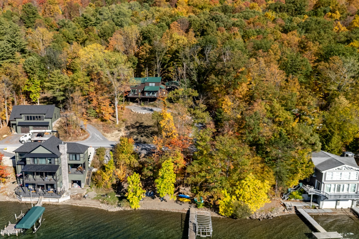 Nestled among vibrant fall foliage, this lakefront retreat offers the perfect blend of privacy and natural beauty.