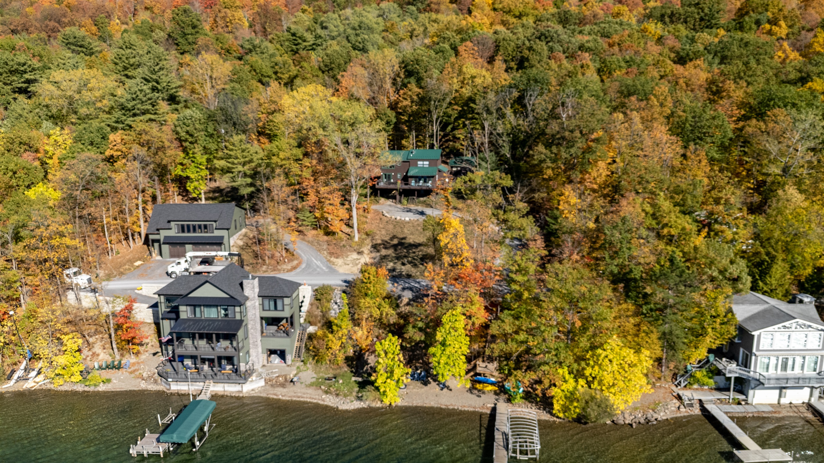 Nestled among vibrant fall foliage, this lakefront retreat offers the perfect blend of privacy and natural beauty.