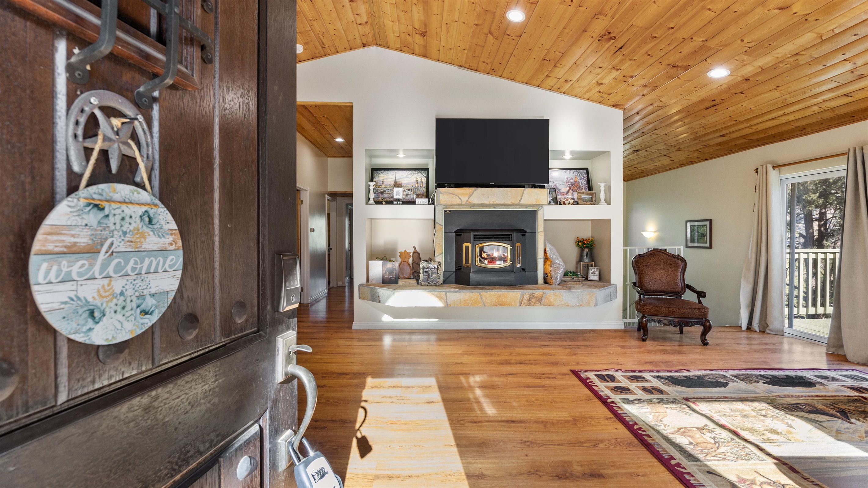 A warm welcome at the front door, with a sneak peek into the cozy living room waiting inside.