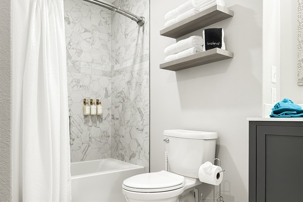 A bathroom with a shower and tub combo — Hot Springs Breakaway