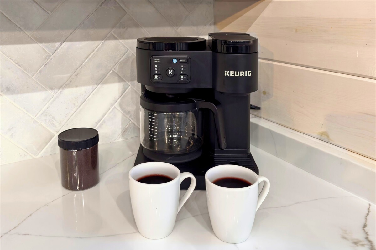 Coffee bar with maker, mugs, and essentials for morning brews.