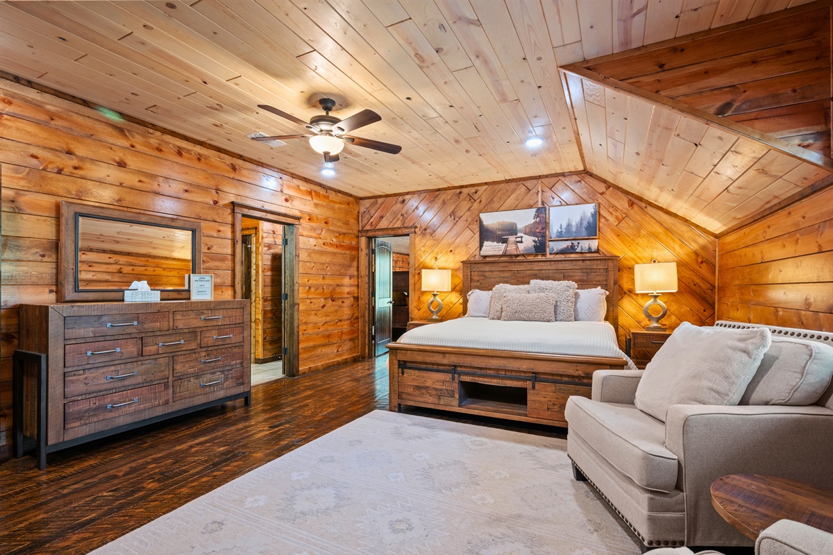 The spacious bedroom features a bright, open layout, providing plenty of room for guests to comfortably get ready.