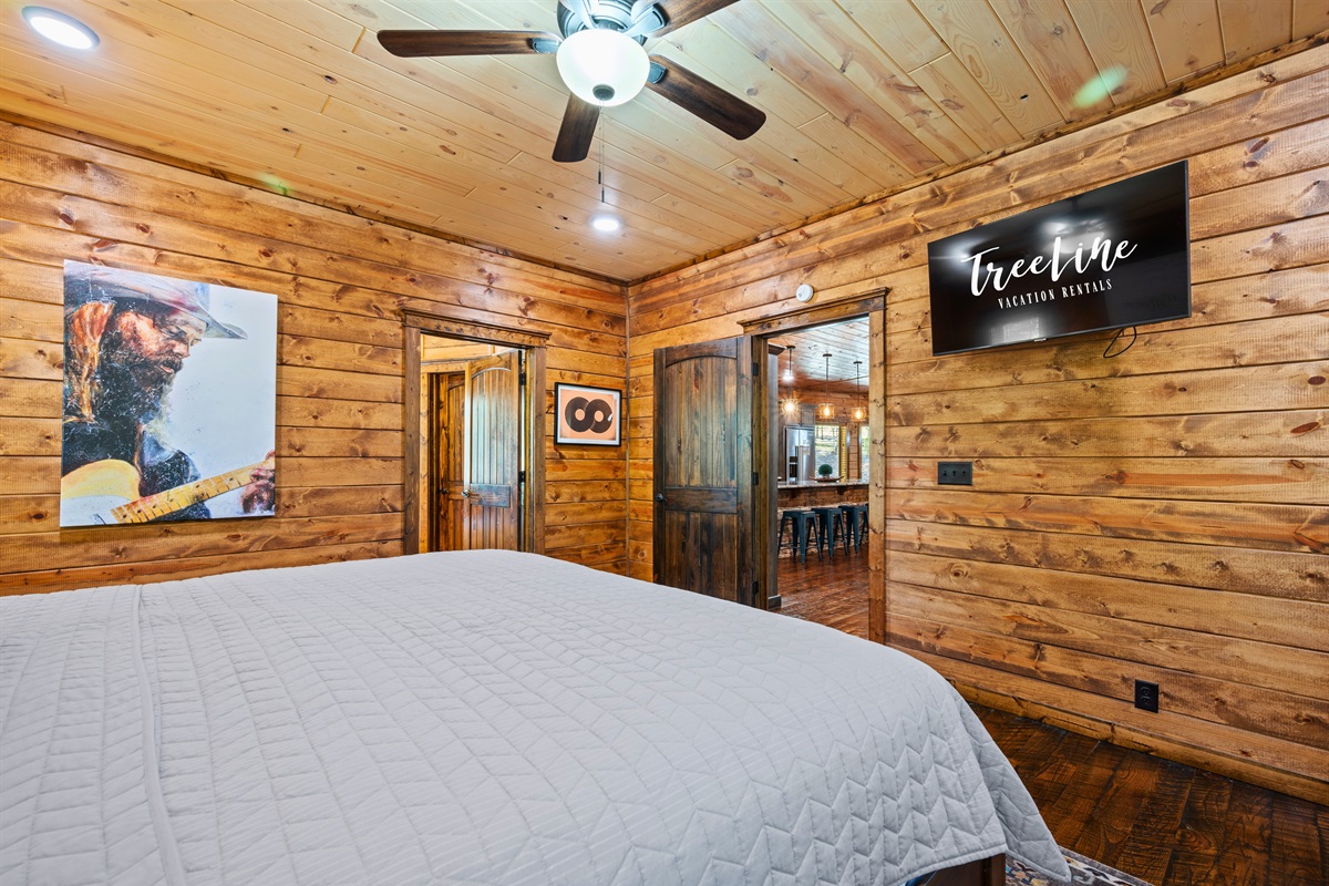 Another view of this inviting bedroom features plenty of space to unwind, along with thoughtful touches that make it feel like home.