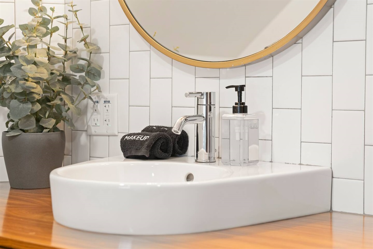 This bathroom vanity blends crisp modern design with warm organic touches.