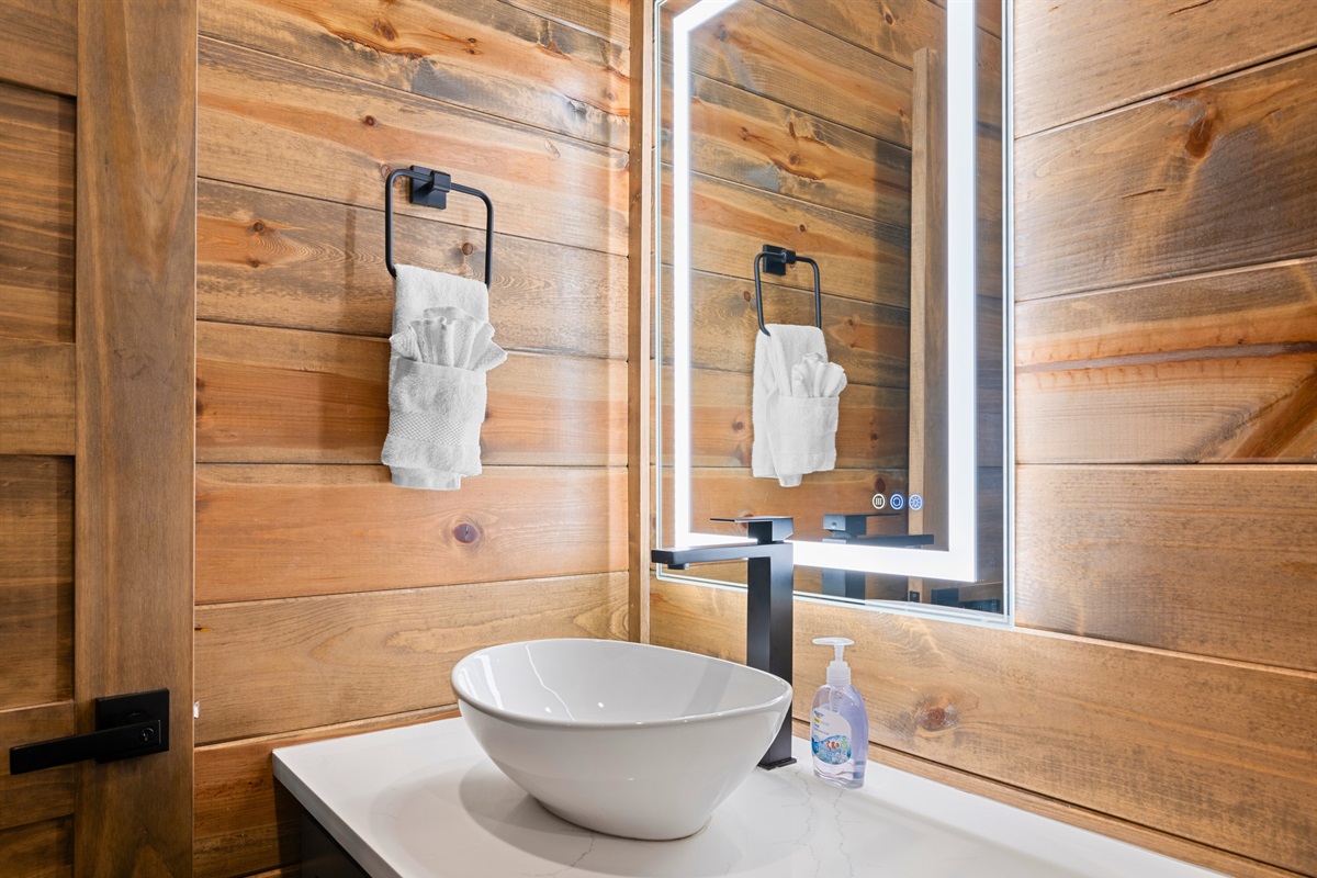 Rustic touches meet modern design in this stylish half bath.