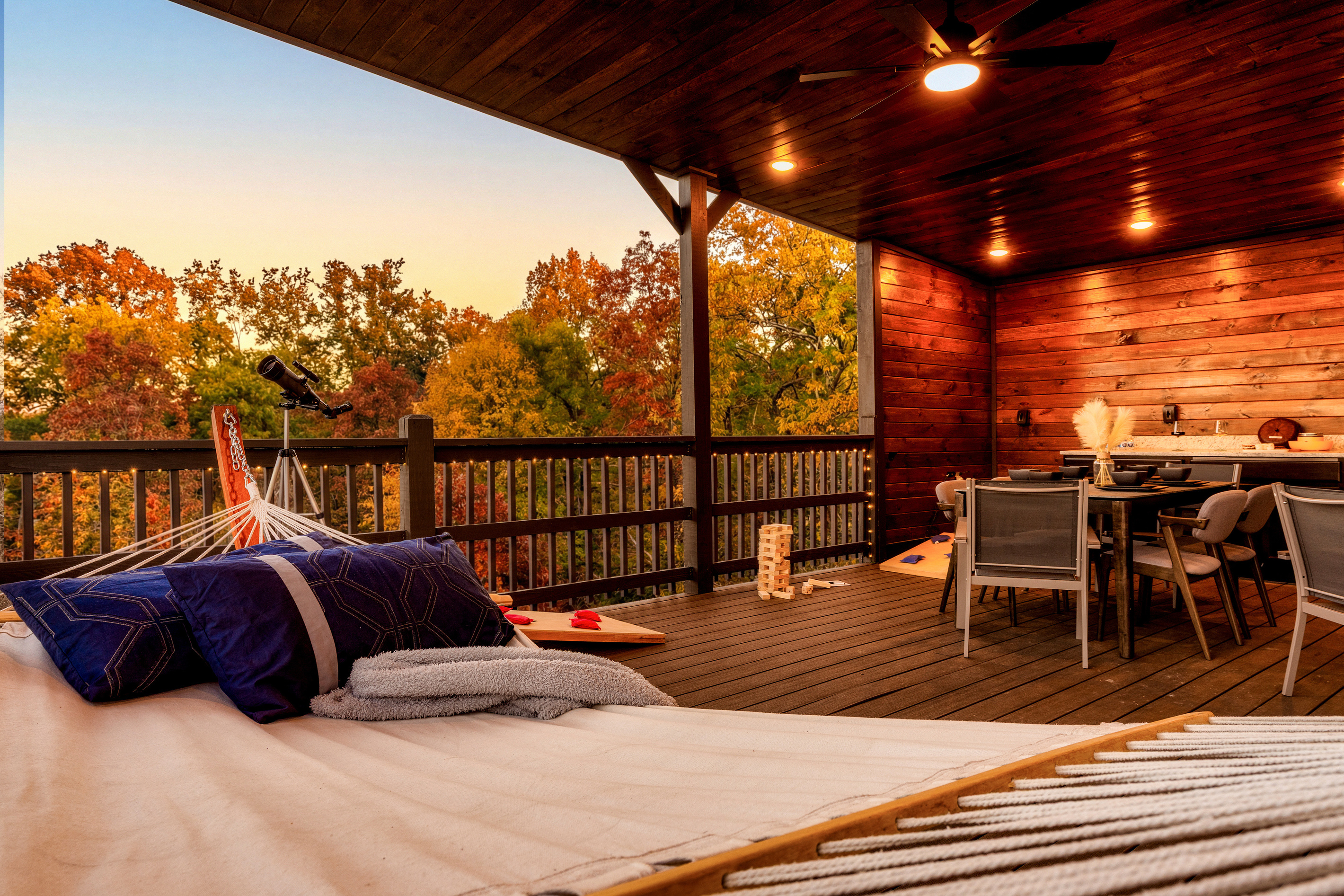 Skydeck outdoor seating with electric fireplace; life size games like cornhole, jumbo blocks and Connect 4.