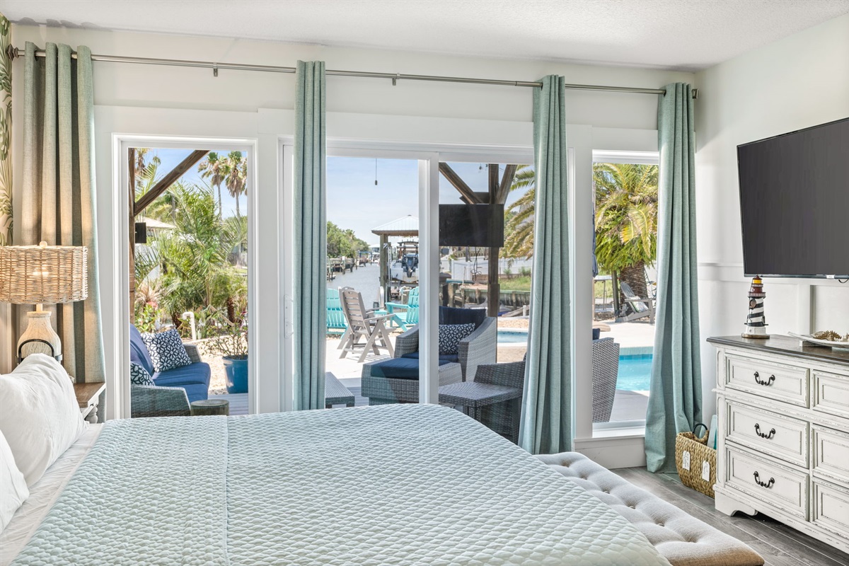 First Floor king Bedroom View of Pool and Canal