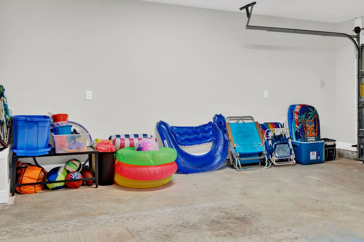 Beach chairs, floats, boogie boards, sand buckets and toys