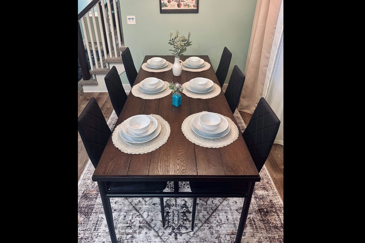 Dining area with seating for six, thoughtfully arranged for shared meals, conversation, and comfortable gatherings.