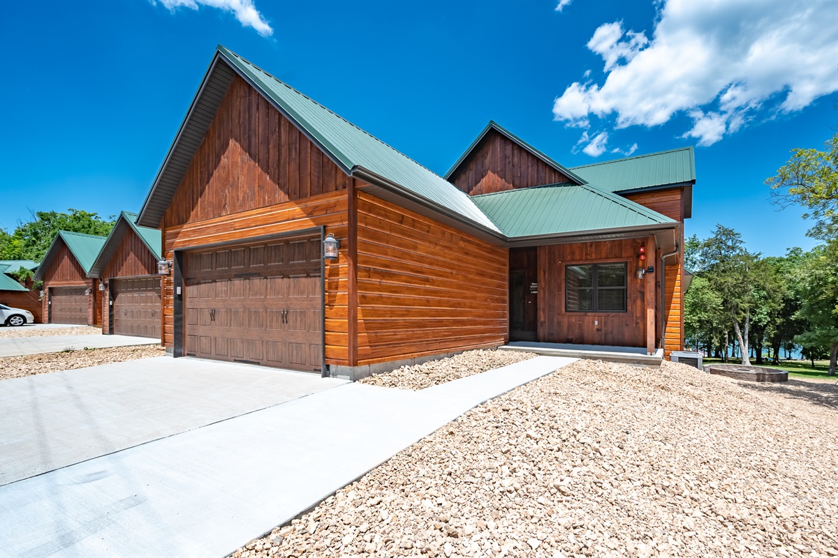 Make yourself at home in this spectacular lodge with private garage only steps from the dock