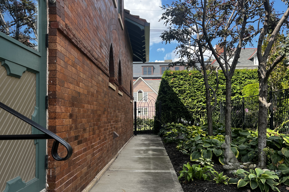 Side walkway along the Carriage House to the private patio