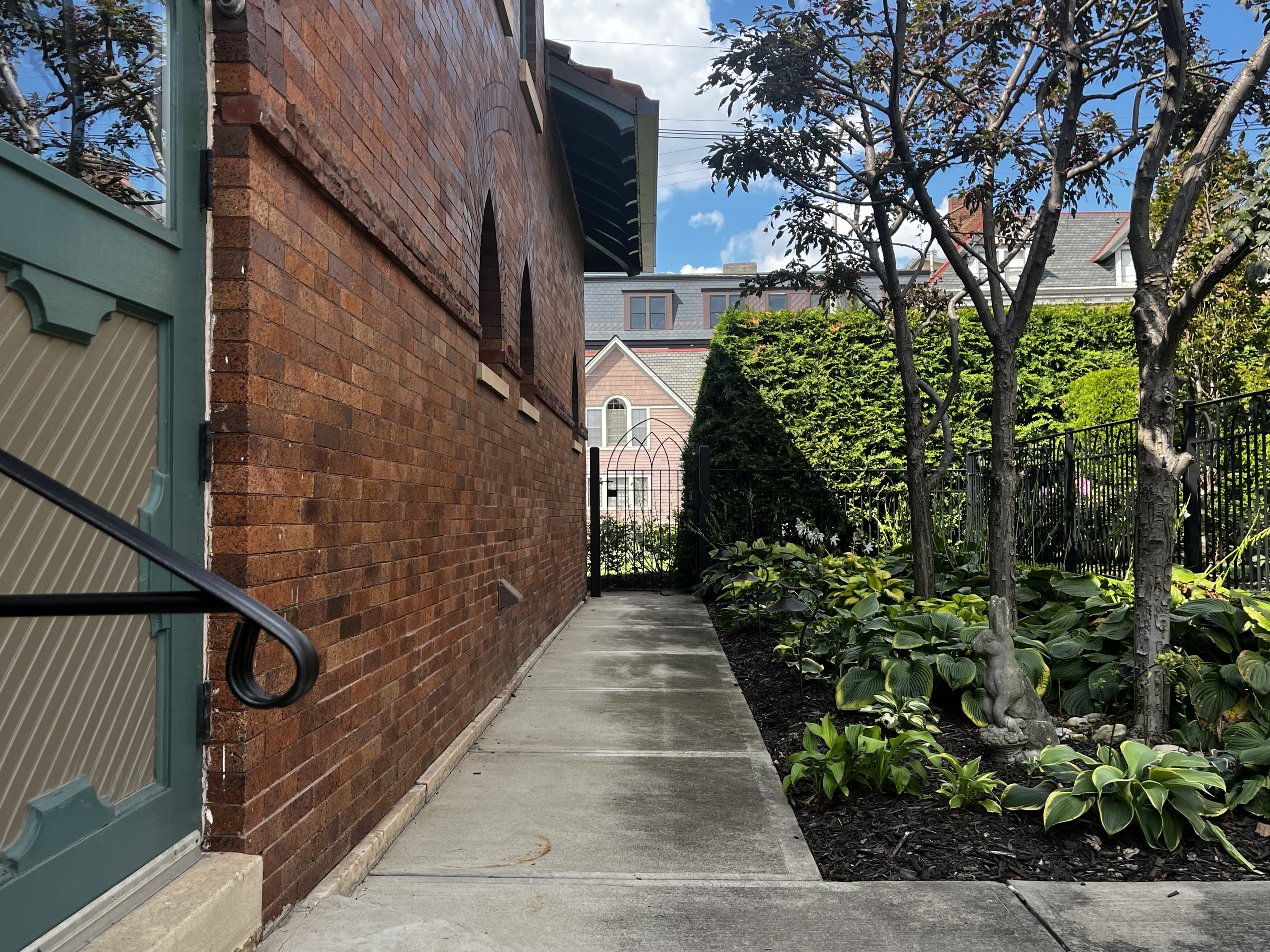 Side walkway along the Carriage House to the private patio