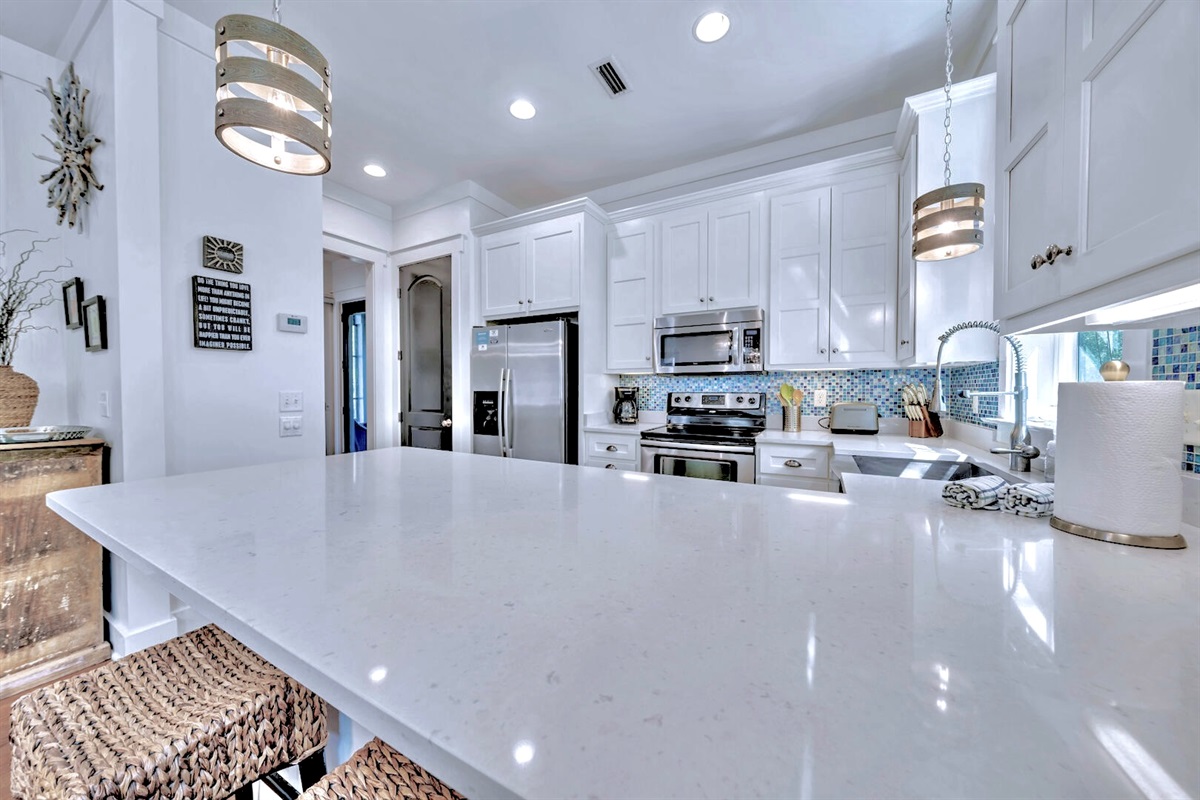 Bright kitchen open to seating & entertainment area