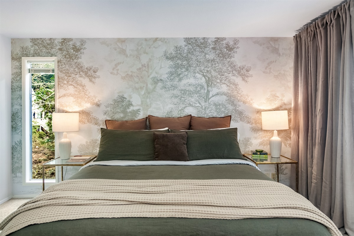 The primary suite with king bed is full of designer touches that will make you feel at home.