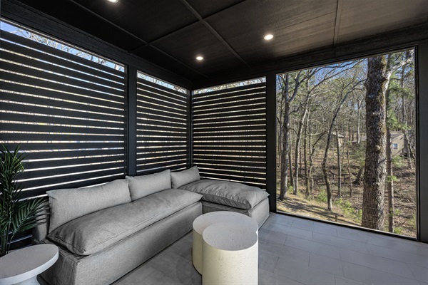 Soak in stunning lake views from the cozy screened-in porch, a peaceful retreat no matter the season.