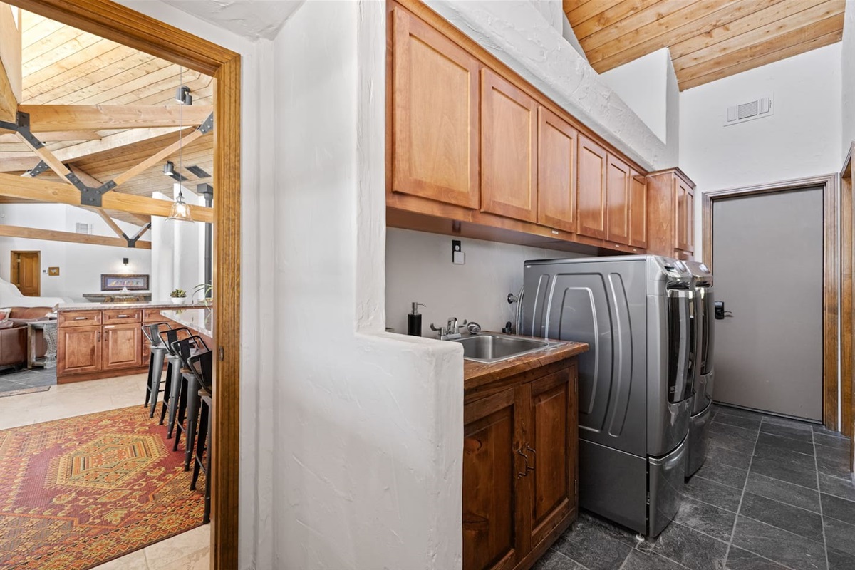 Laundry room, stocked with detergent, extra cleaning supplies
