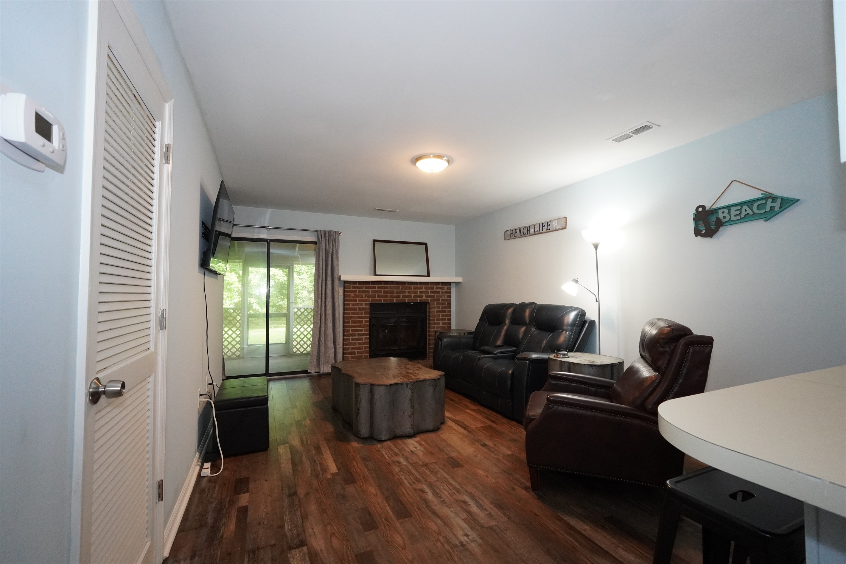 Living space with private screened-in porch access