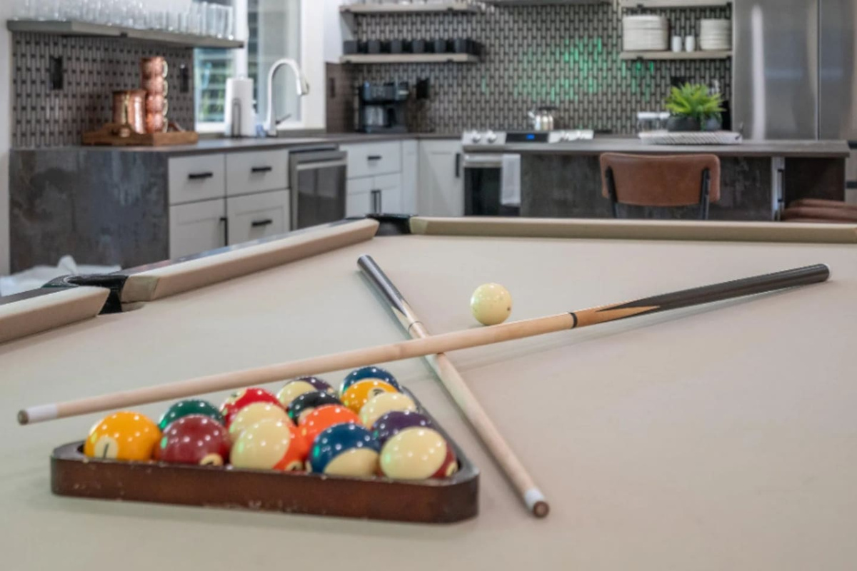 Balls racked and cues ready, this table is set for a friendly night of pool.
