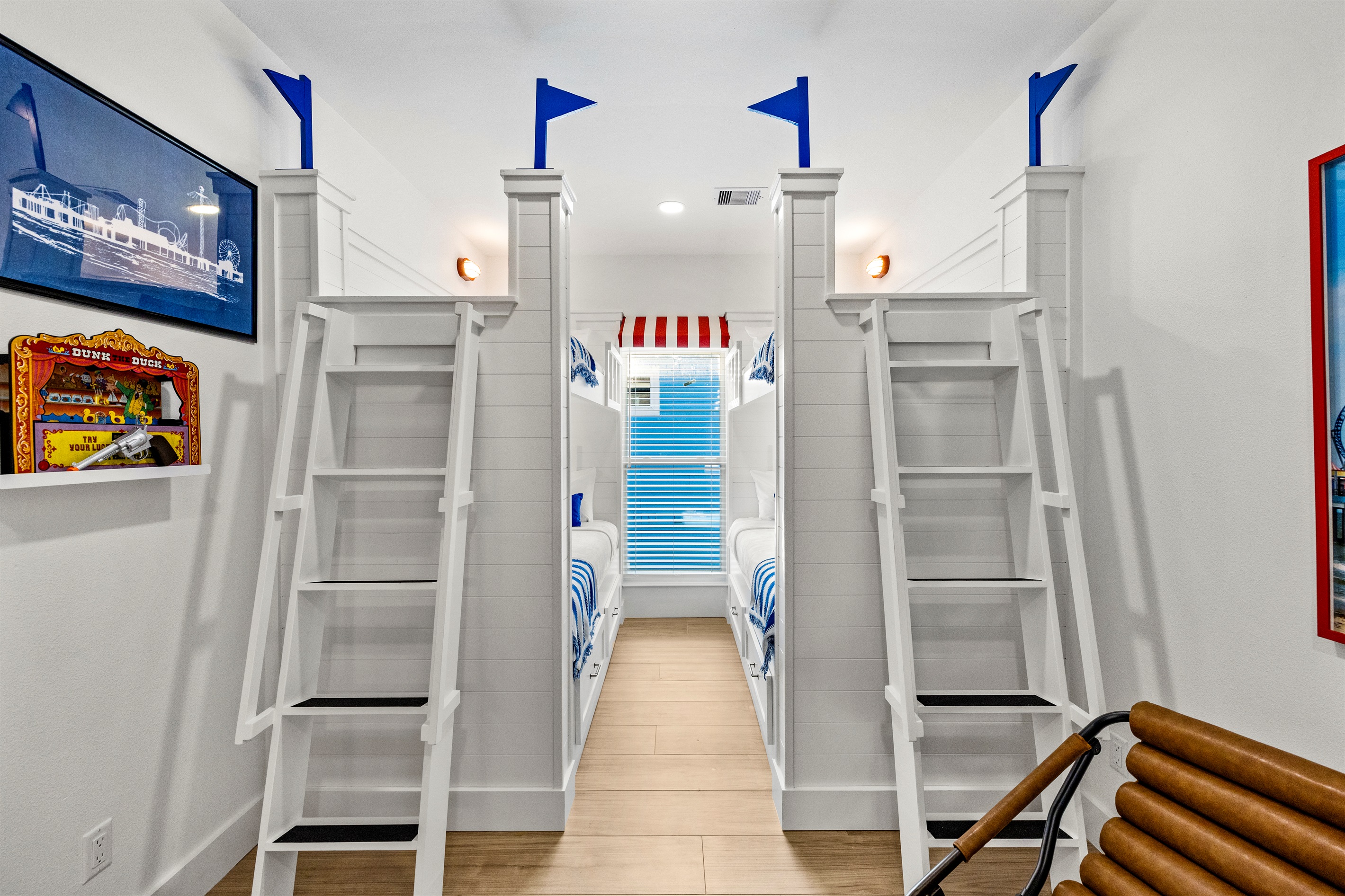 Pleasure Pier Guest Suite sleeps 6 guests! This room has all of the fun with space to hang out! The adorable 4 bunk beds are spacious and include spacious headroom.