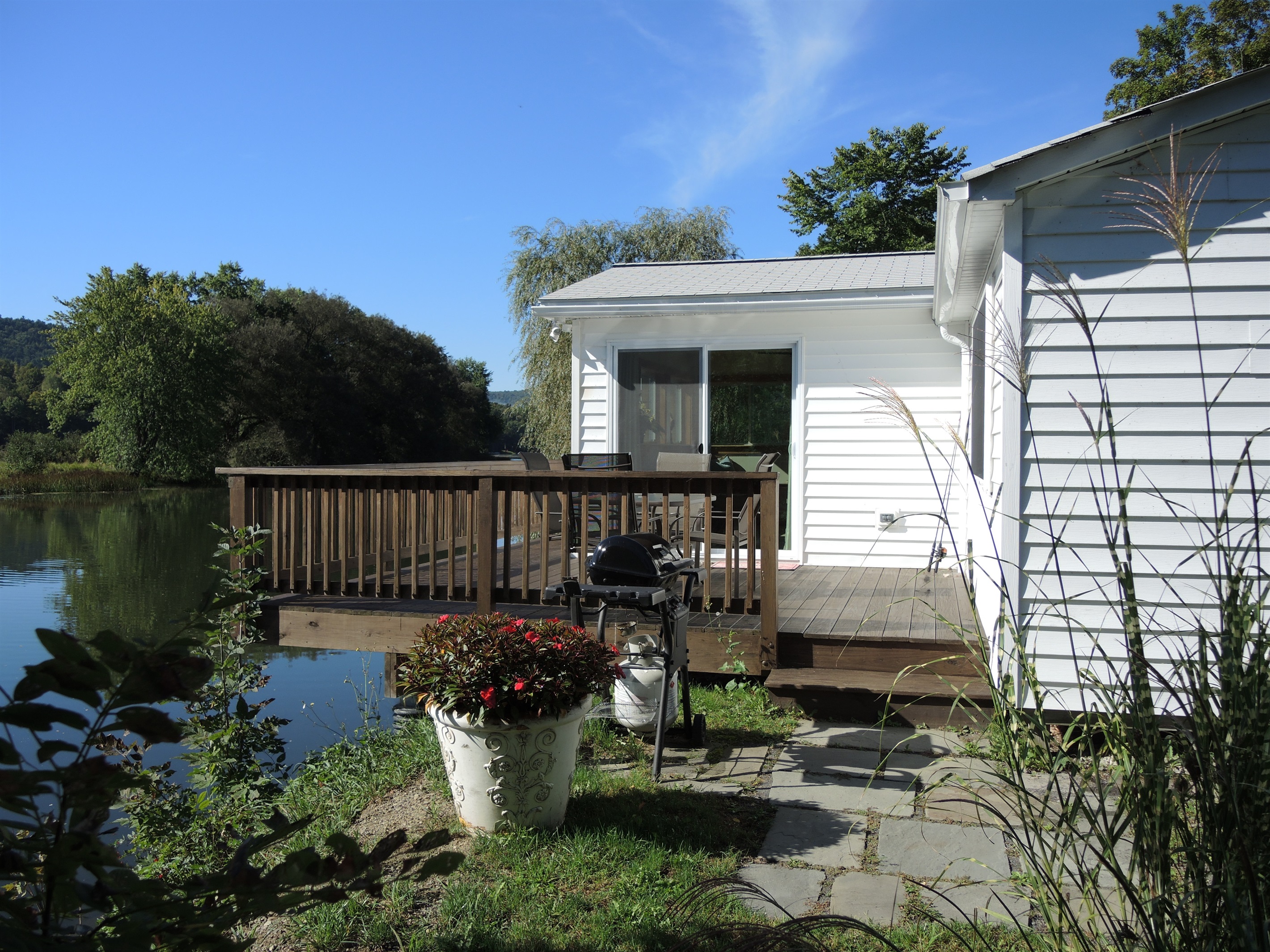 Kick back and relax on the deck overlooking water