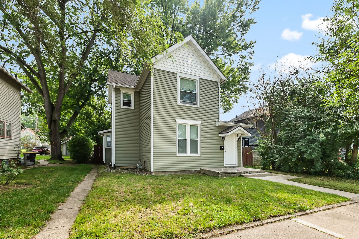 Charming curb appeal with a tidy lawn and welcoming front entrance.