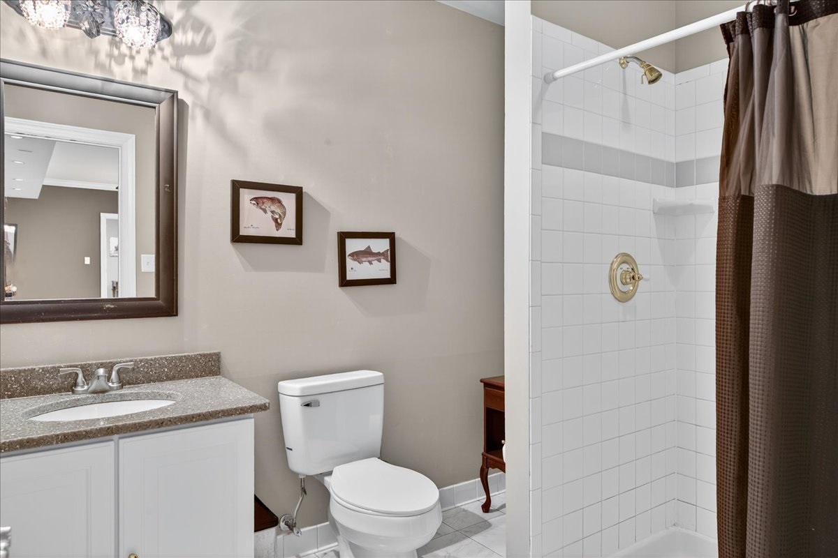 Downstairs full bath with modern walk-in shower.