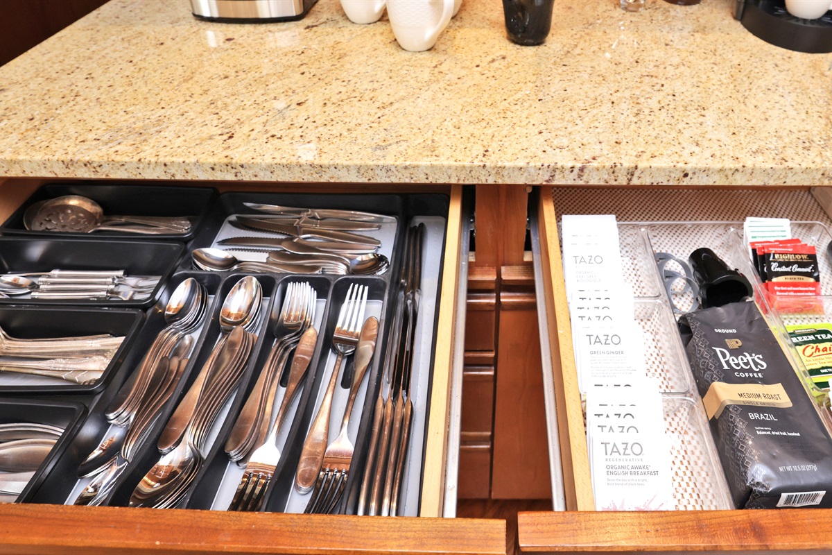 Flatware and serving ware plus coffee/tea drawer at right.